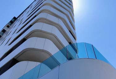a tall building with a clock towering over a building