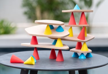An educational game for creating structures from colored silicone cones and wooden tables