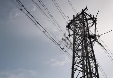 Close-up of a drone capturing detailed images of a bridge structure.