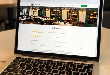 a man riding a skateboard down a street next to tall buildings