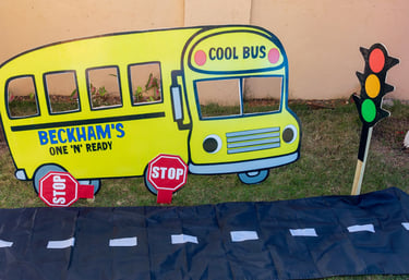 party props of s school bus stop sign with a school bus sign