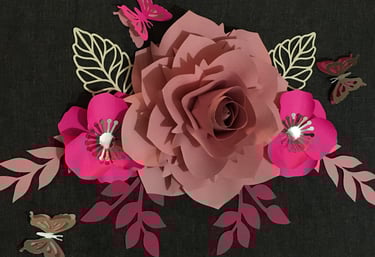 a paper flower with butterflies and butterflies