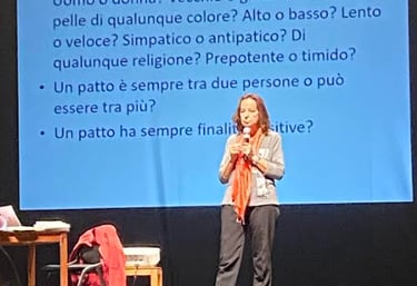 a woman standing on a stage with a microphone and a microphone