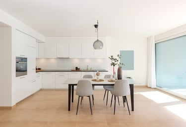 a dining room with a table and chairs