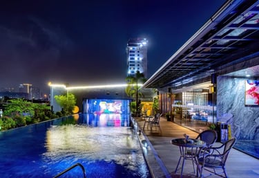 a pool with a view of a city at night