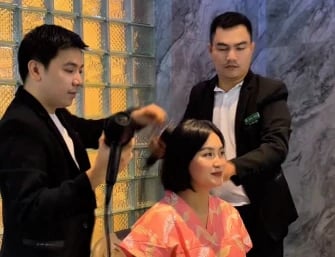 a man and woman in a salon