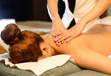 a woman getting a massage at a spa