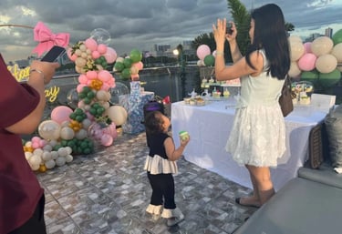 a woman is taking a picture of a young girl