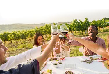 picnic table with friends and wine