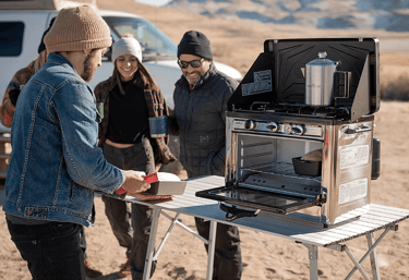 campers using a Camp Chef Portable Camp Oven for easy camp cooking