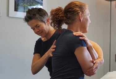 Therapist treating patient's upper back