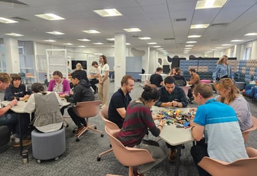 Workshop session with participants collaborating using Lego for team building activities