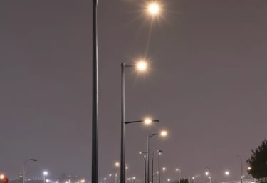 a man riding a skateboard down a street next to tall buildings