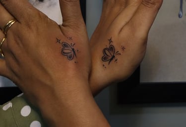 Fine line butterfly tattoo in minimal style by Dudo’s Tattoos Hyderabad