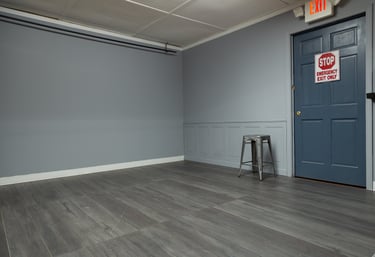 a photo studio room with gray walls and panels