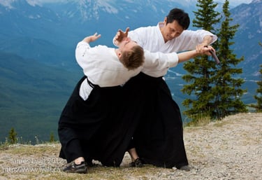 Ishikawa sensei and sjoh practicing traditional martial arts in alberta