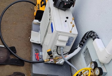 Mini split air conditioner outdoor unit being installed