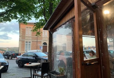 Exterior view of a local pizzeria in San Marino called Insolito Posto, located in Serravalle