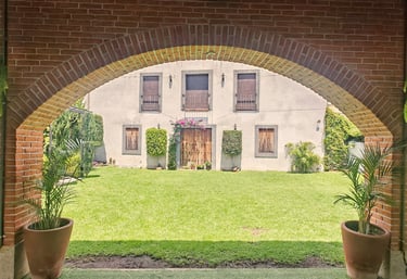 a brick wall with a clock on the outside
