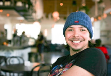 a man in a blue hat and a blue beanie