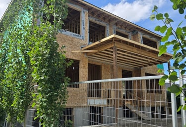 Custom duplex construction with wood framing on a Calgary residential lot.