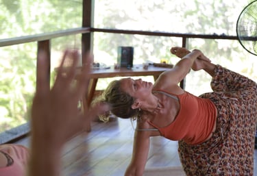 a woman in a floral dress in a yoga position