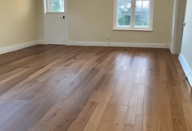 A professional sanding machine in action on wooden floors.