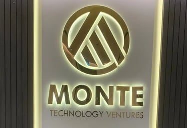 Monte Technology 3D Brushed Stainlesss Steel Signage with backlite behind reception desk of office