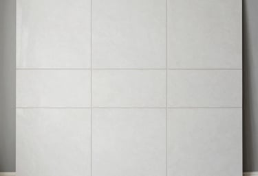 A close-up view of a marble surface showcasing intricate patterns and veins in shades of gray and white. The natural swirls and textures create a dramatic and elegant appearance.