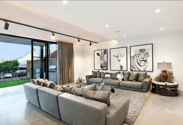 a living room with a couch and a large window