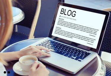 Person using a laptop to draft a blog post, focused on digital content writing services.