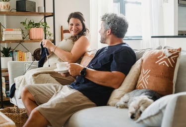 a man and woman sitting on a couch
