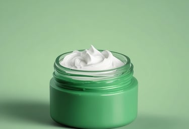 A green cosmetic jar with a minimalist design, featuring the letter 'C' prominently on its front. The jar appears to be floating against a solid green background, creating a sense of simplicity and elegance.