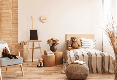a bedroom with a bed, chair, and a chair