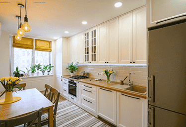 a kitchen with a table and chairs and a table