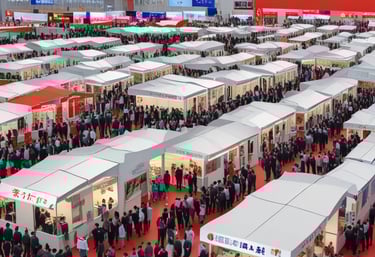 Exhibition booth at an international trade fair showcasing products and networking.