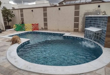 Suasana malam kolam renang air hangat di villa Subang, lampu menyala.