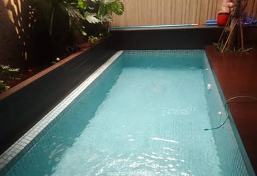 a pool with a pool and a wooden deck