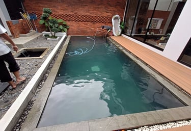pemakuman kolam renang dengan finishing kolam renang batu alam andesit