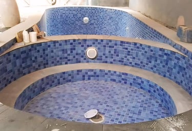 pembuatan kolam renang dan jakuzzi yangf menjadi satu.