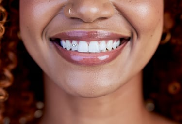 a woman with curly hair and a smile on her face