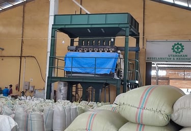 Automated green coffee bean sorter machine used at Dwipa Coffee warehouse, Sumatra. Color Picker.