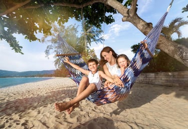 Family relaxing on hammock beach during Koh Samui photoshoot