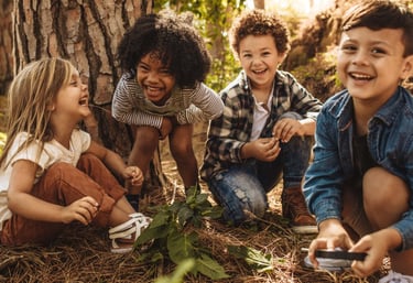 a group of children playing and smiling
