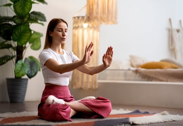 a woman sitting on a rug in a room