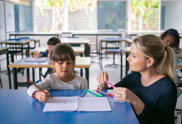 a woman and a child are sitting at a table