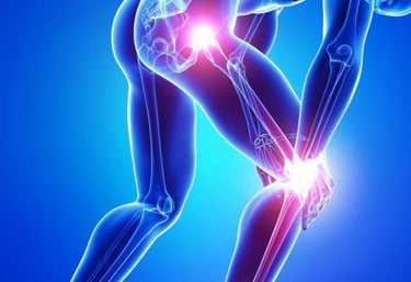 An orthopedic surgeon examining an X-ray of a patient’s knee joint in a clinical setting.