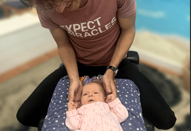 Dr. Spencer providing gentle chiropractic care for a baby with colic