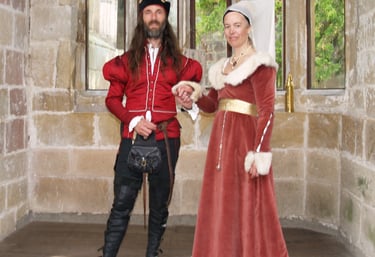 a man and woman in medieval costumes