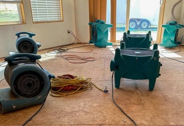 Air movers dry wet subfloors. Water restoration.